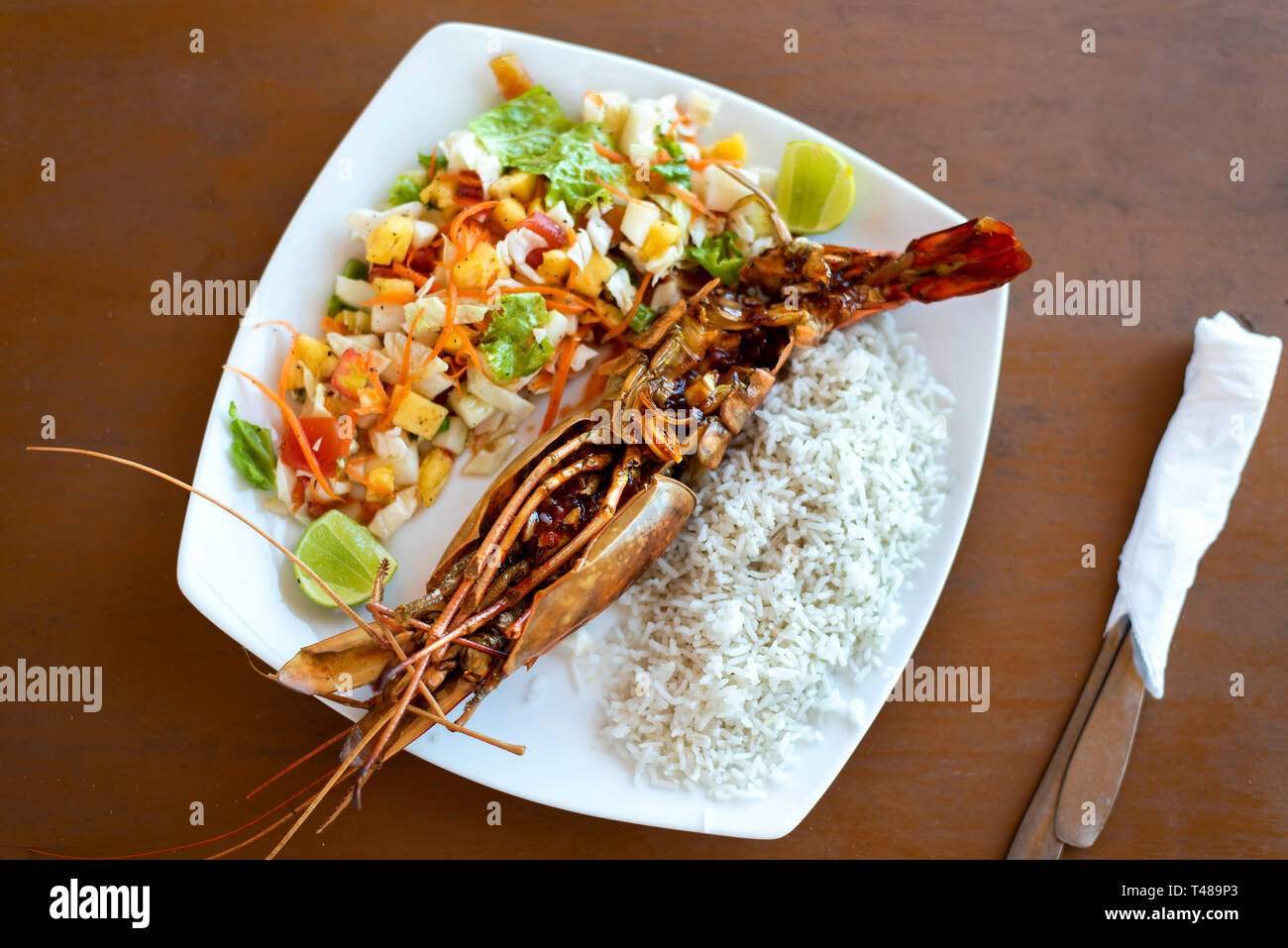 Jungle prawn with rice and salad on a plate Stock Photo