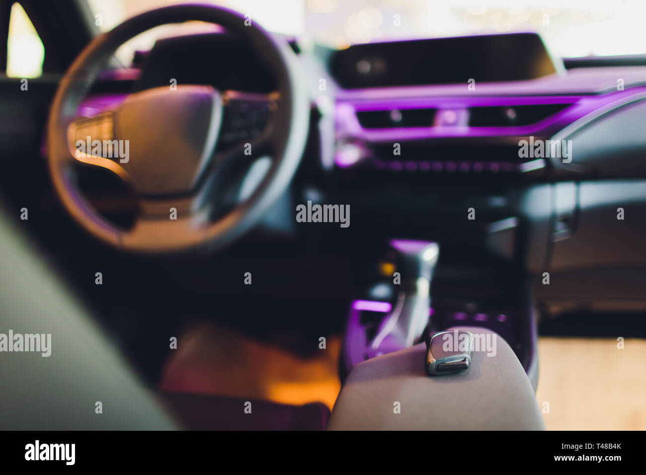 Dark luxury car Interior steering wheel, shift lever and dashboard