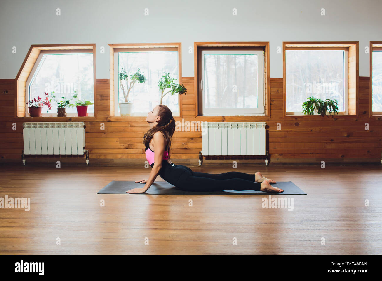 Girl doing bhujangasana cobra pose hi-res stock photography and images ...