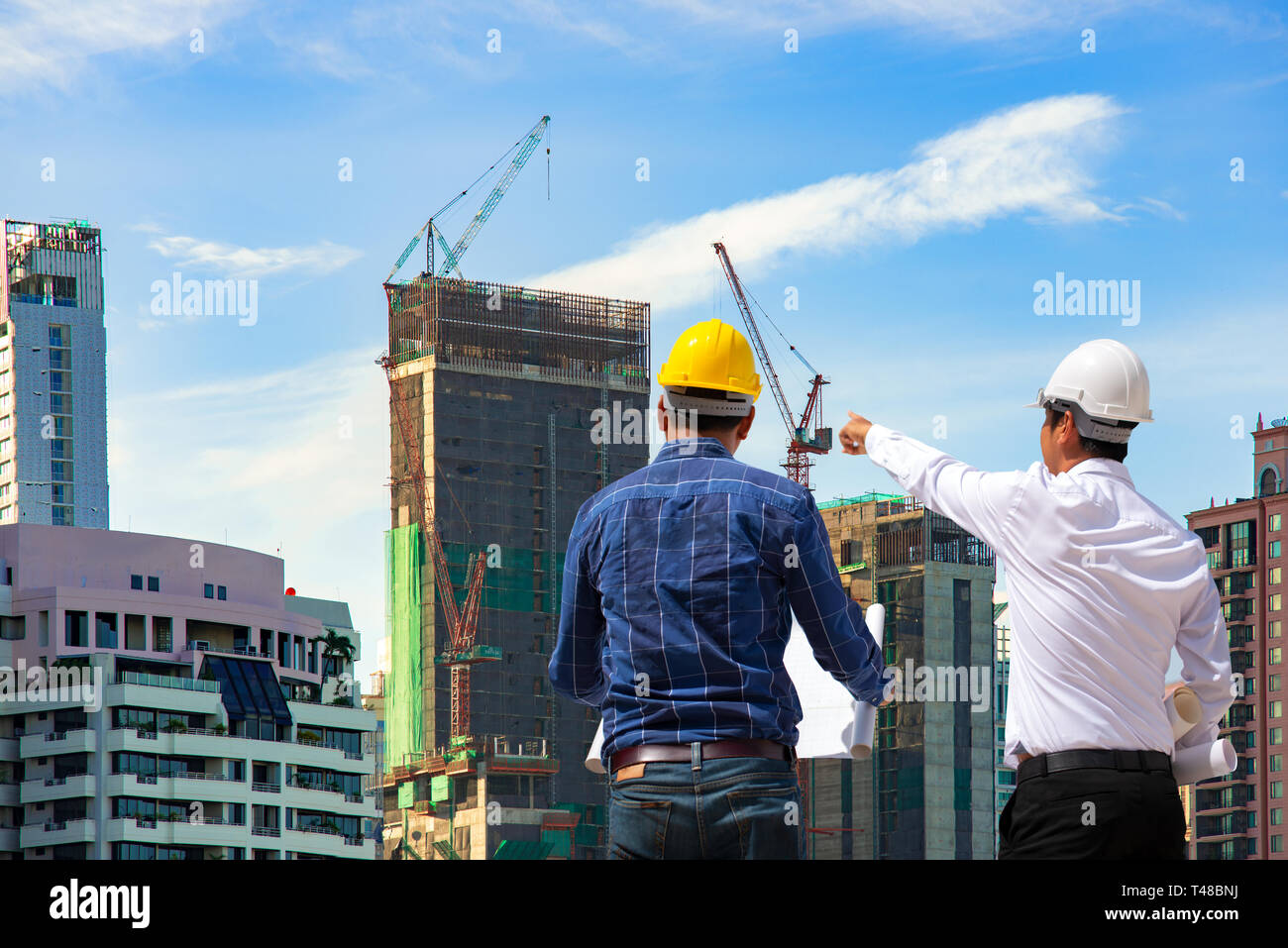 two construction engineer working in construction site and management