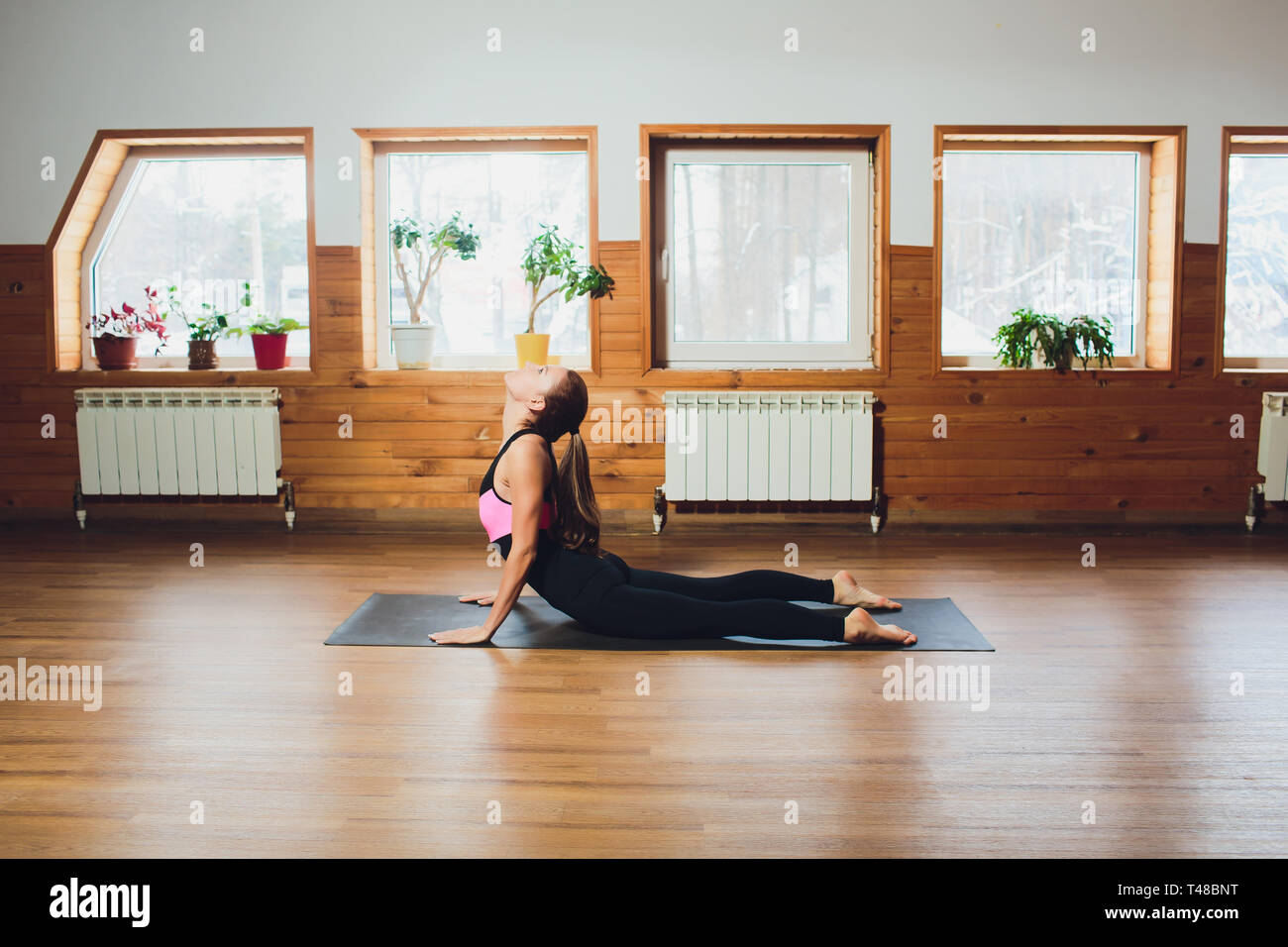 Girl doing bhujangasana cobra pose hi-res stock photography and images ...