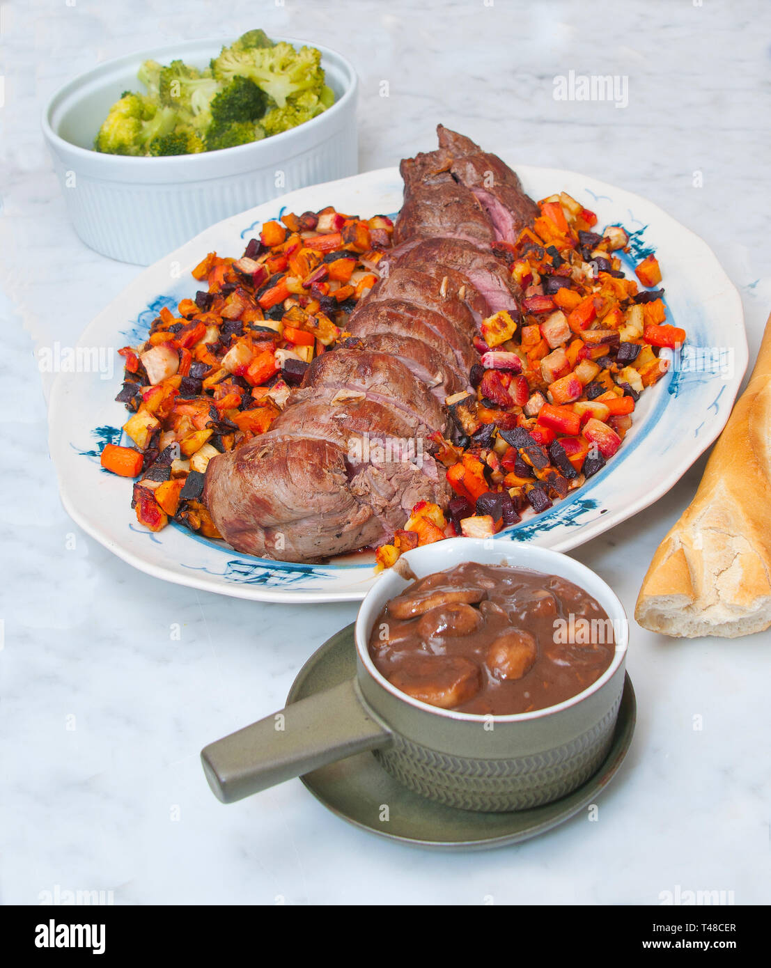 A roast tenderloin with gravy Stock Photo Alamy