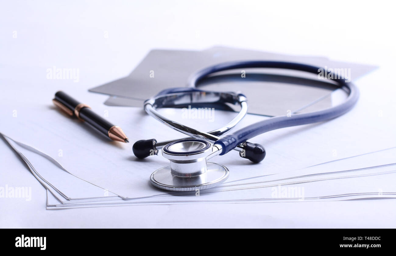 stethoscope,x-ray and pen on the table. Stock Photo