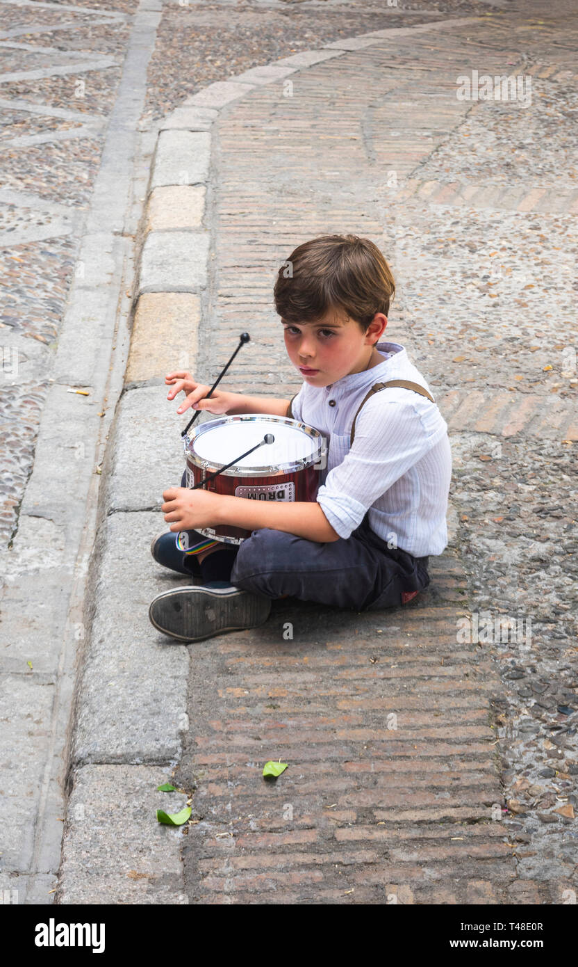 Little drummer boy sitting alone in Seville, Spain Stock Photo