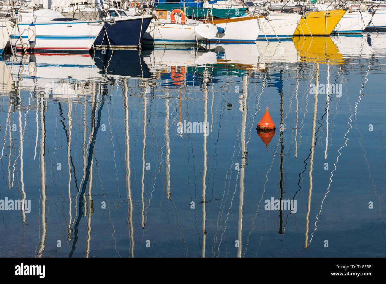 Colorful boats reflecting in the water Stock Photo - Alamy