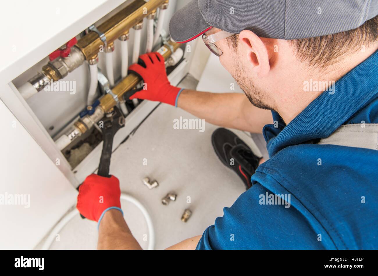 Plumbing System Fix Job. Caucasian Technician Looking For Potential