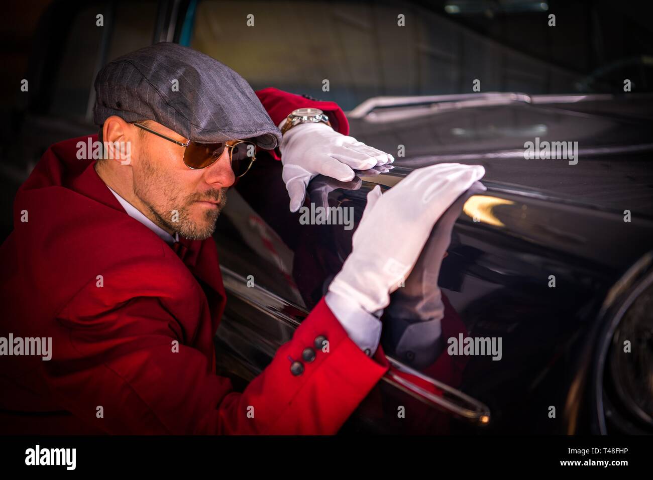 Vintage Classic Cars Collector. Caucasian Men Taking Close Look on the Vehicle Body. Automotive Theme. Stock Photo