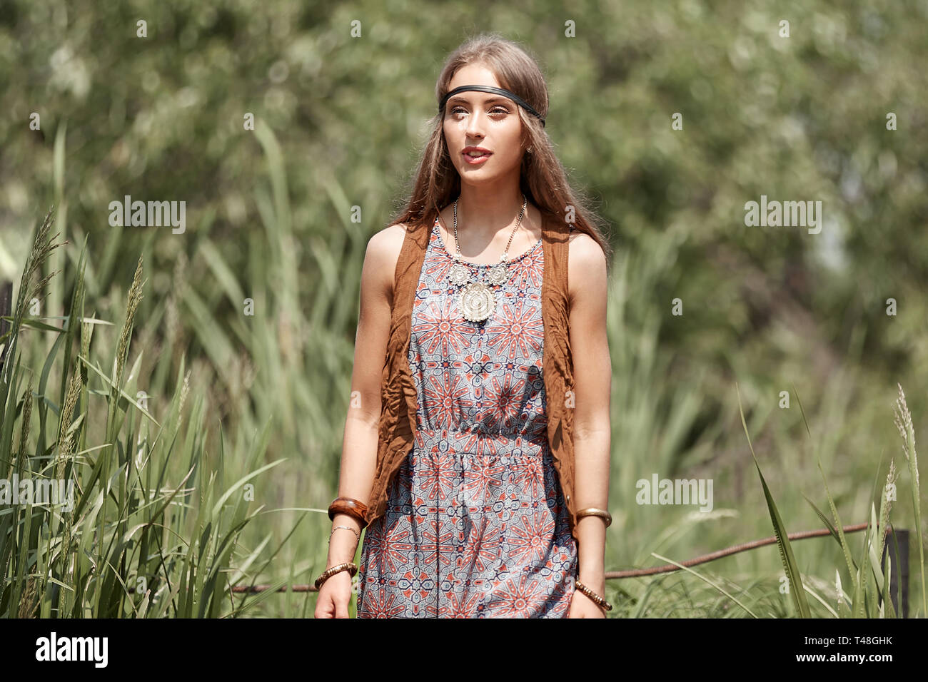 cute hippie girl on the background of summer Park . the concept of unity with nature Stock Photo