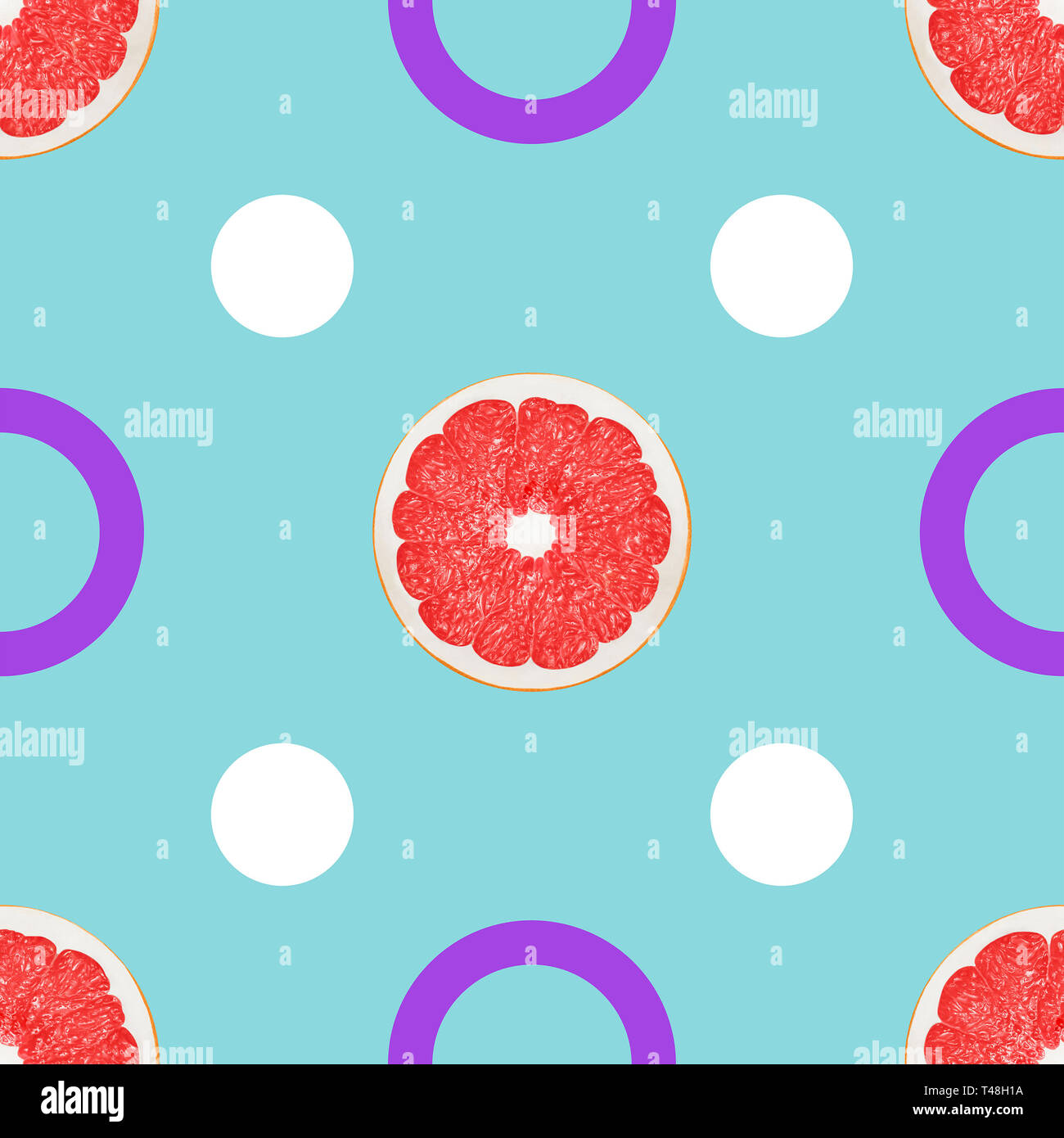 Seamless pattern with grapefruit Geometric background with different circles and grapefruit halves on a light blue backdrop Stock Photo