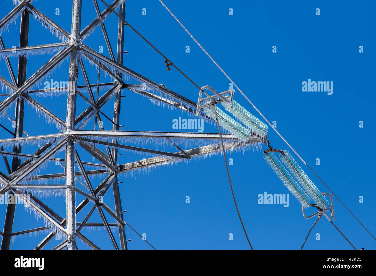 freezing rain on electric pole and wire, Montreal, 9 April, 2019 Stock