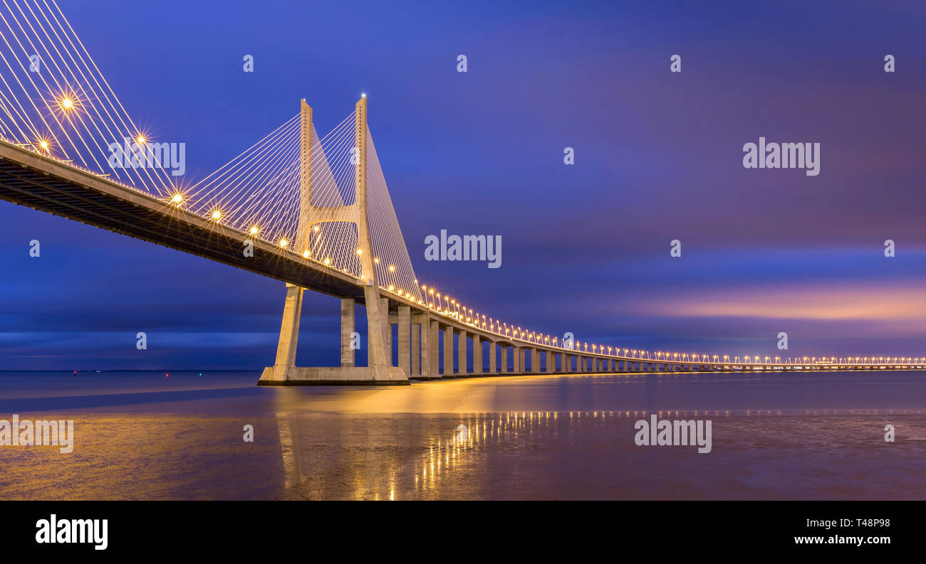 The famous Vasco de Gama bridge lies near Lisbon in Portugal and connects two parts of the city accross the Tejo river. Stock Photo