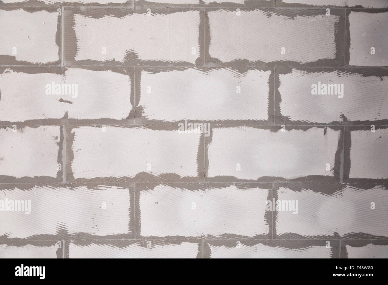 Closeup Wall Of Gray Aerated Concrete With Rough Seams With Glue