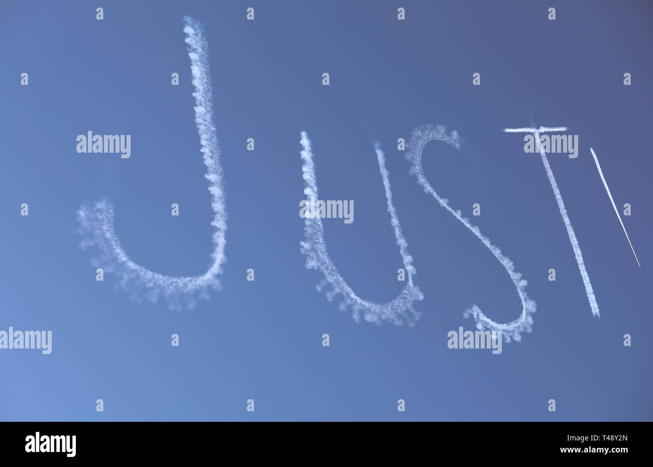 Blue sky with writing letters "Just" Stock Photo