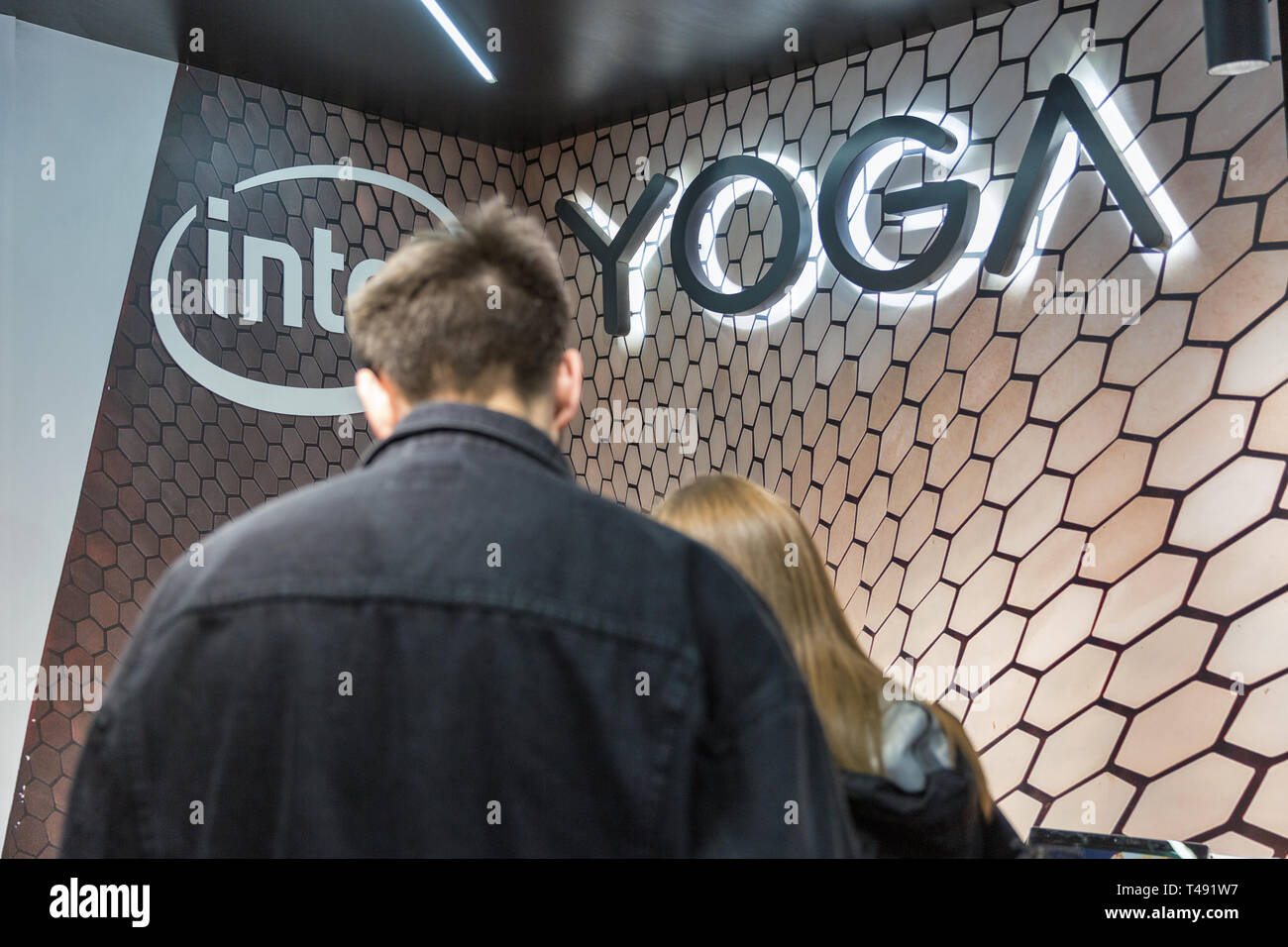 KYIV, UKRAINE - APRIL 06, 2019: People visit Lenovo Intel Yoga, a Chinese multinational technology company booth during CEE 2019, the largest electron Stock Photo