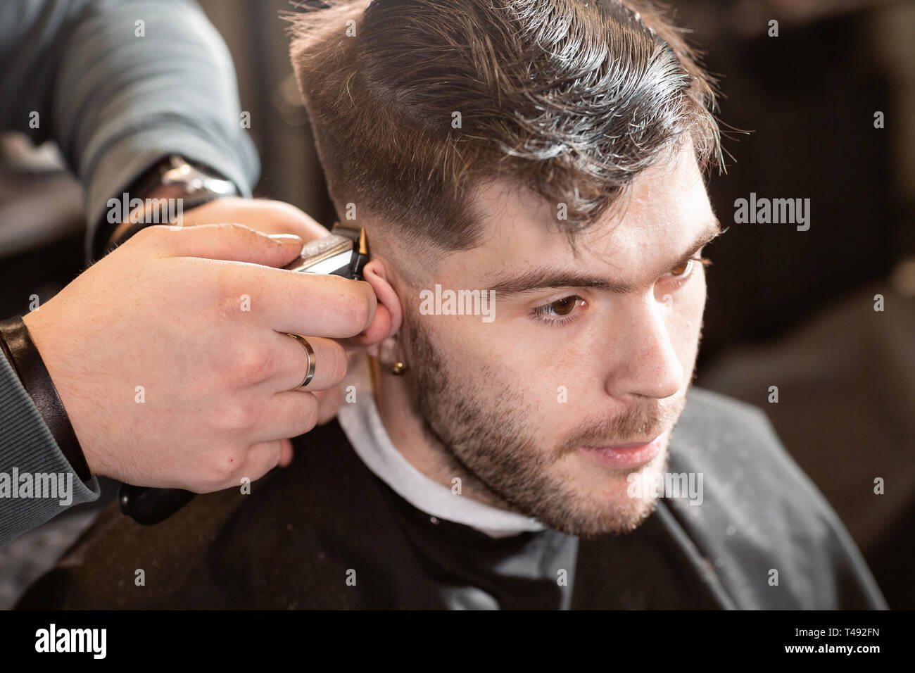 Barber Work With Clipper Machine In Barbershop Professional