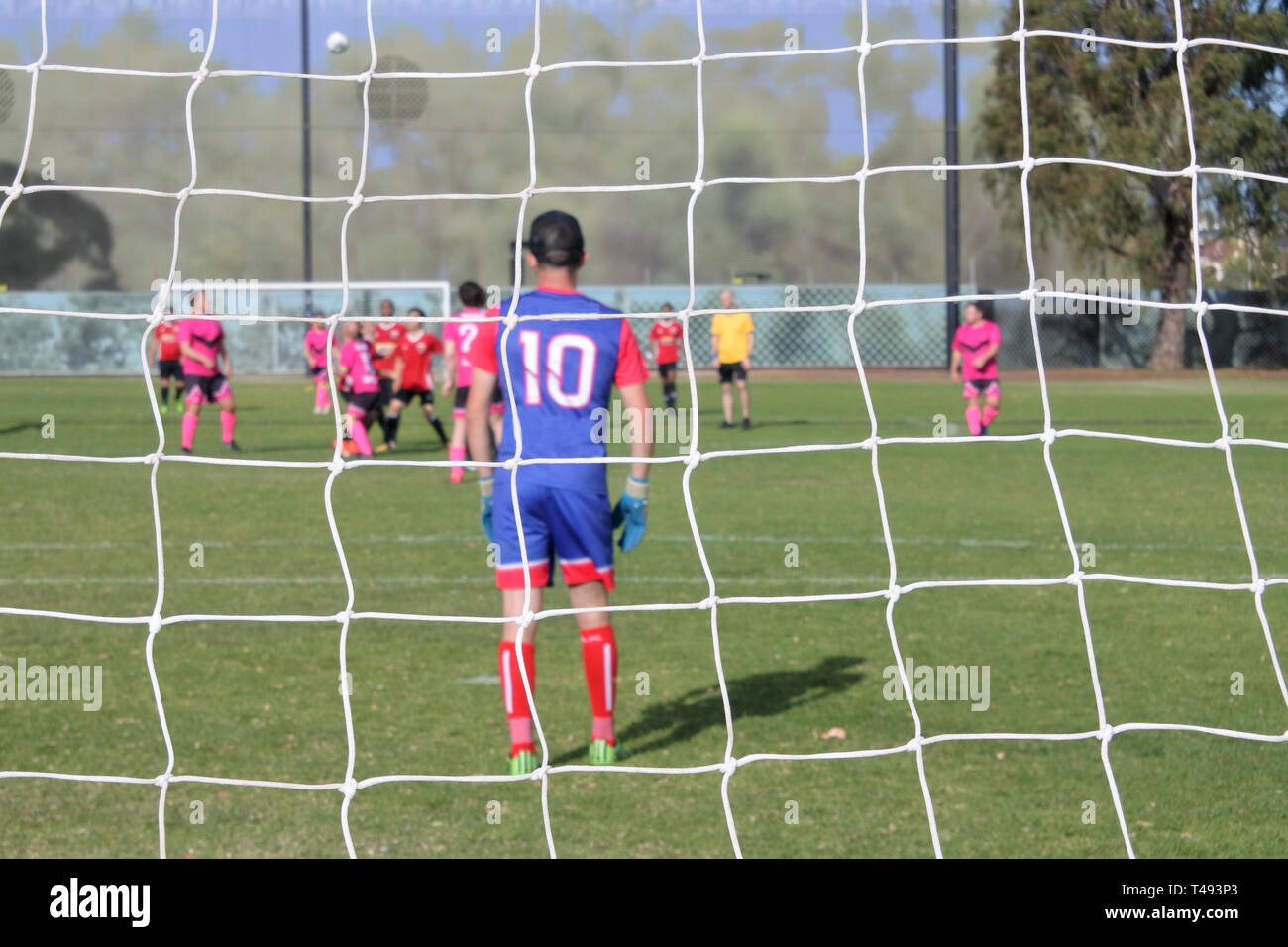 Football Soccer Goal Post Net Background Against Unrecognizable Soccer Players In Outdoor Public Football Field On Weekend Day Stock Photo Alamy