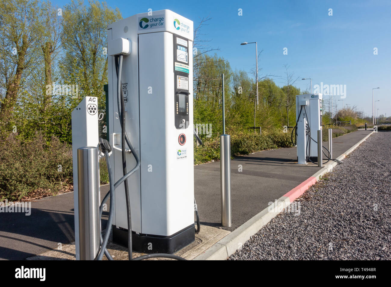 Electrical charging points to charge electric cars in Mereoak Park and Ride car park in Reading, Berkshire, UK Stock Photo