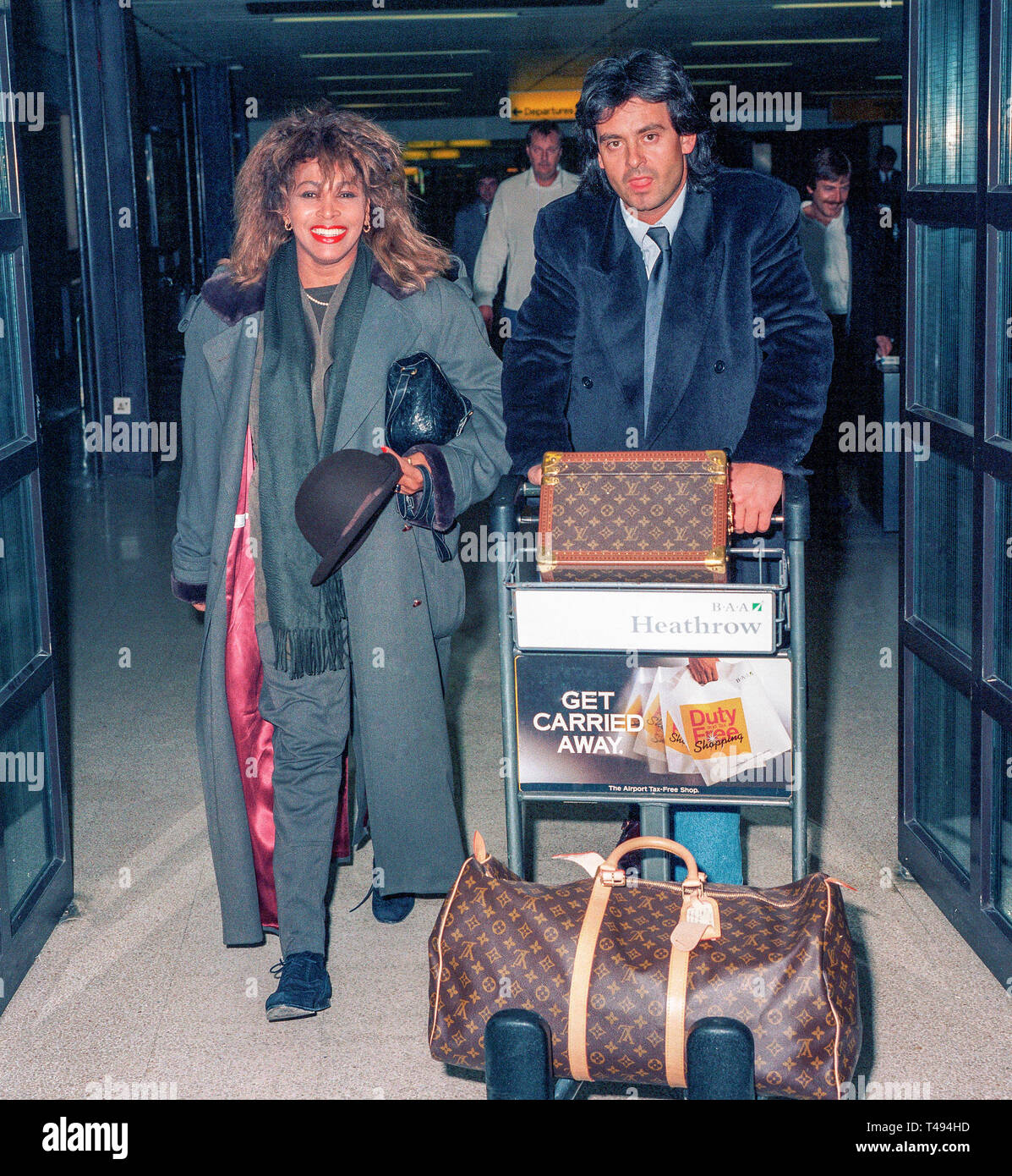 American born rock singer Tina Turner arriving at London's Heathrow Airport with boyfriend Erwin