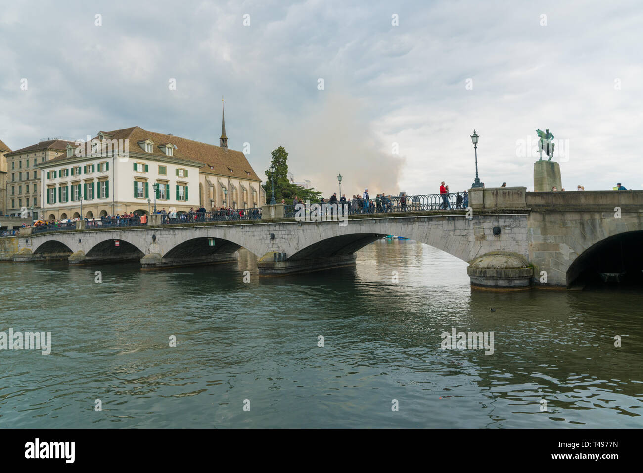 Zurich, ZH / Switzerland - April 8, 2019: Zurich cityscape with many people leaving at the end of the traditional spring festival of Sechselauten in A Stock Photo