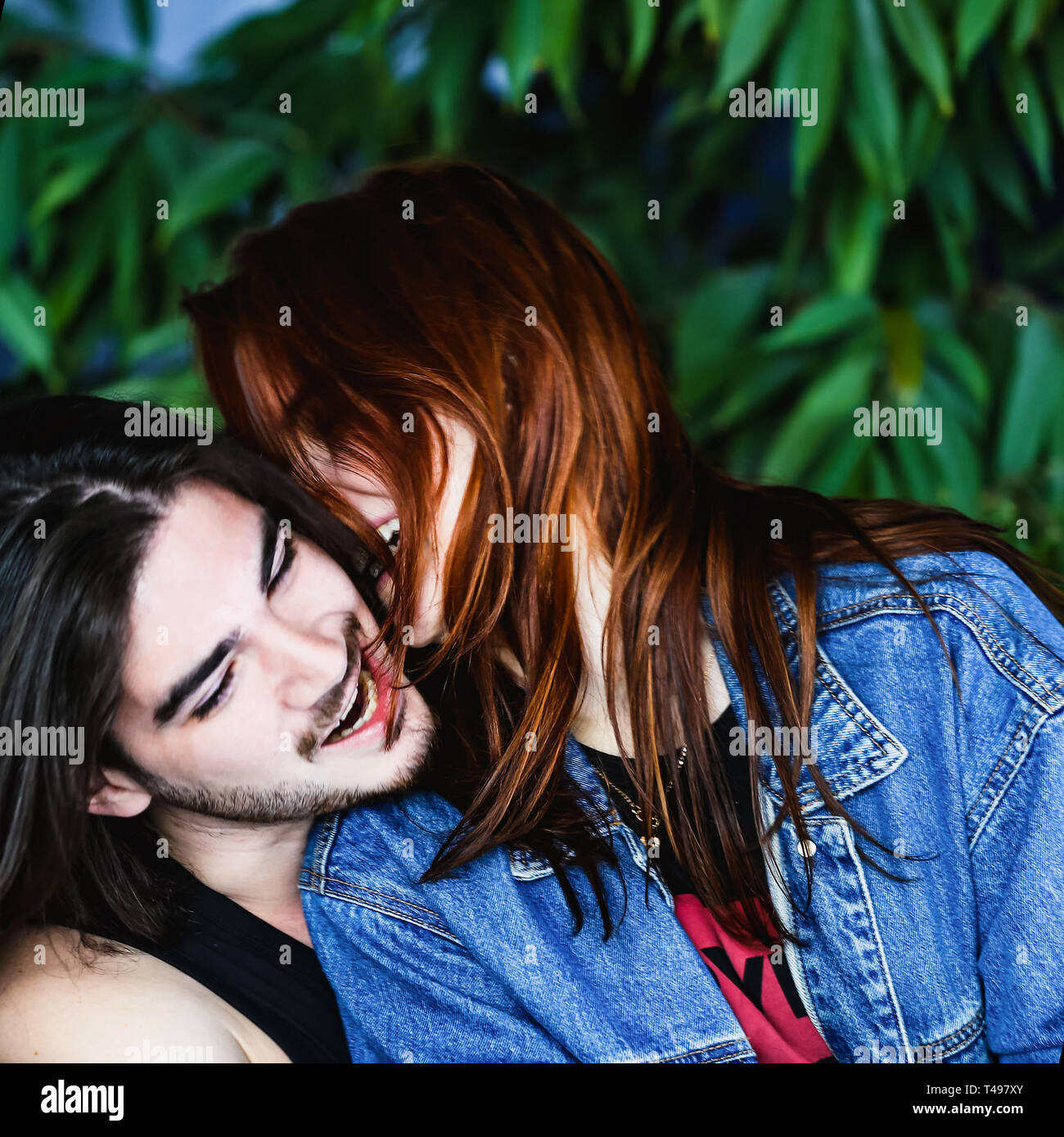 Happy couple in love, having fun and fooling around outdoors and ...