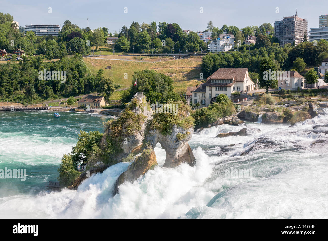 The Rhine Falls is the largest waterfall in Europe in Schaffhausen, Switzerland. Summer day with sun. View from castle Laufen Stock Photo