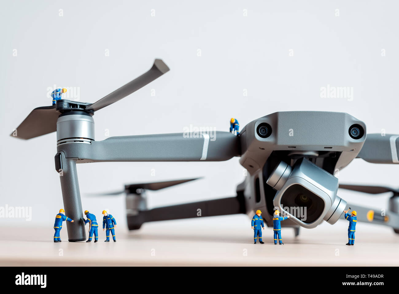 Team of engineers inspects the engines of a drone Stock Photo - Alamy