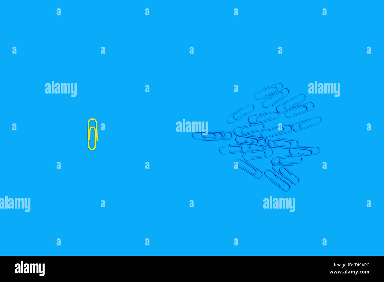 paper clips on a blue background Stock Photo