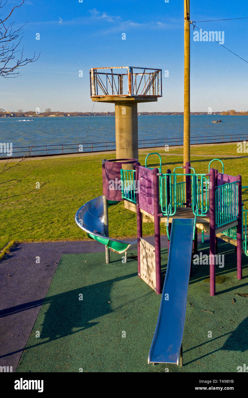 Detroit, Michigan - A playground next to the base of an abandoned Cold War-era Nike missile radar tower on the Detroit River. Hundreds of the anti-air Stock Photo