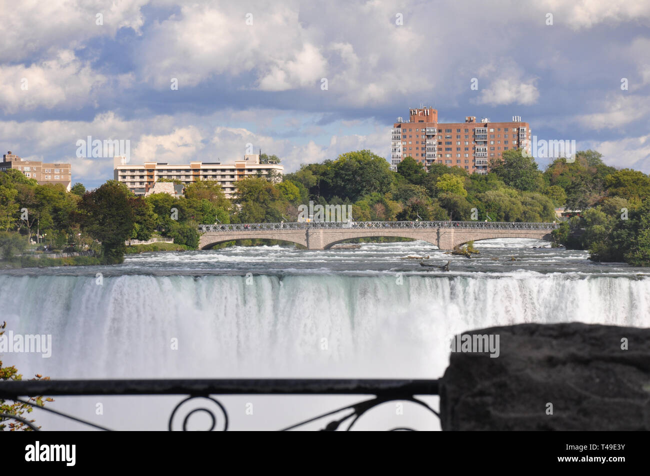 View of the Niagara River and Bridge above the American Falls at Niagara Falls, United States Stock Photo