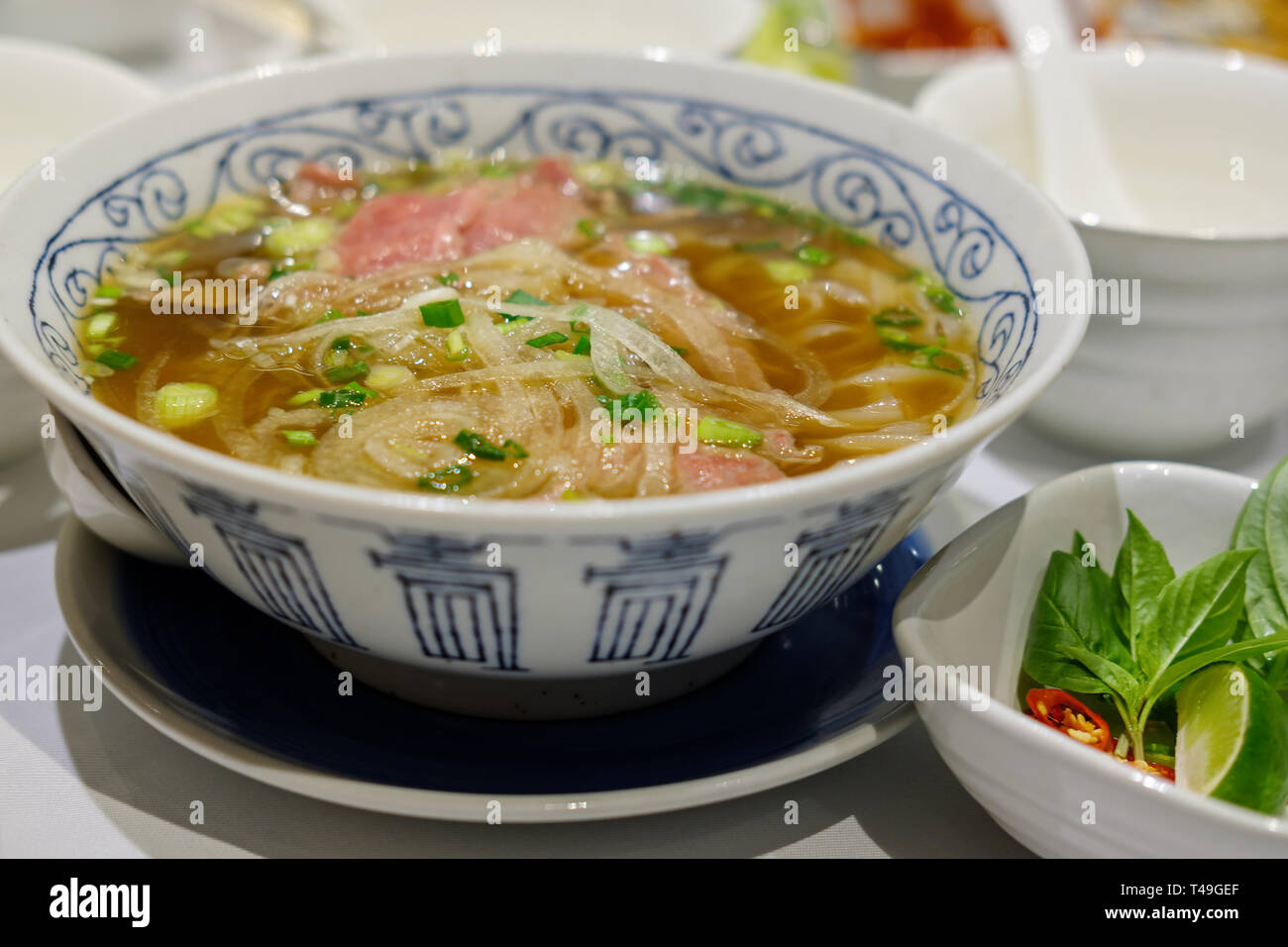 Rice pasta with sliced raw beef in veal (vietnamese pho Beef Noodle