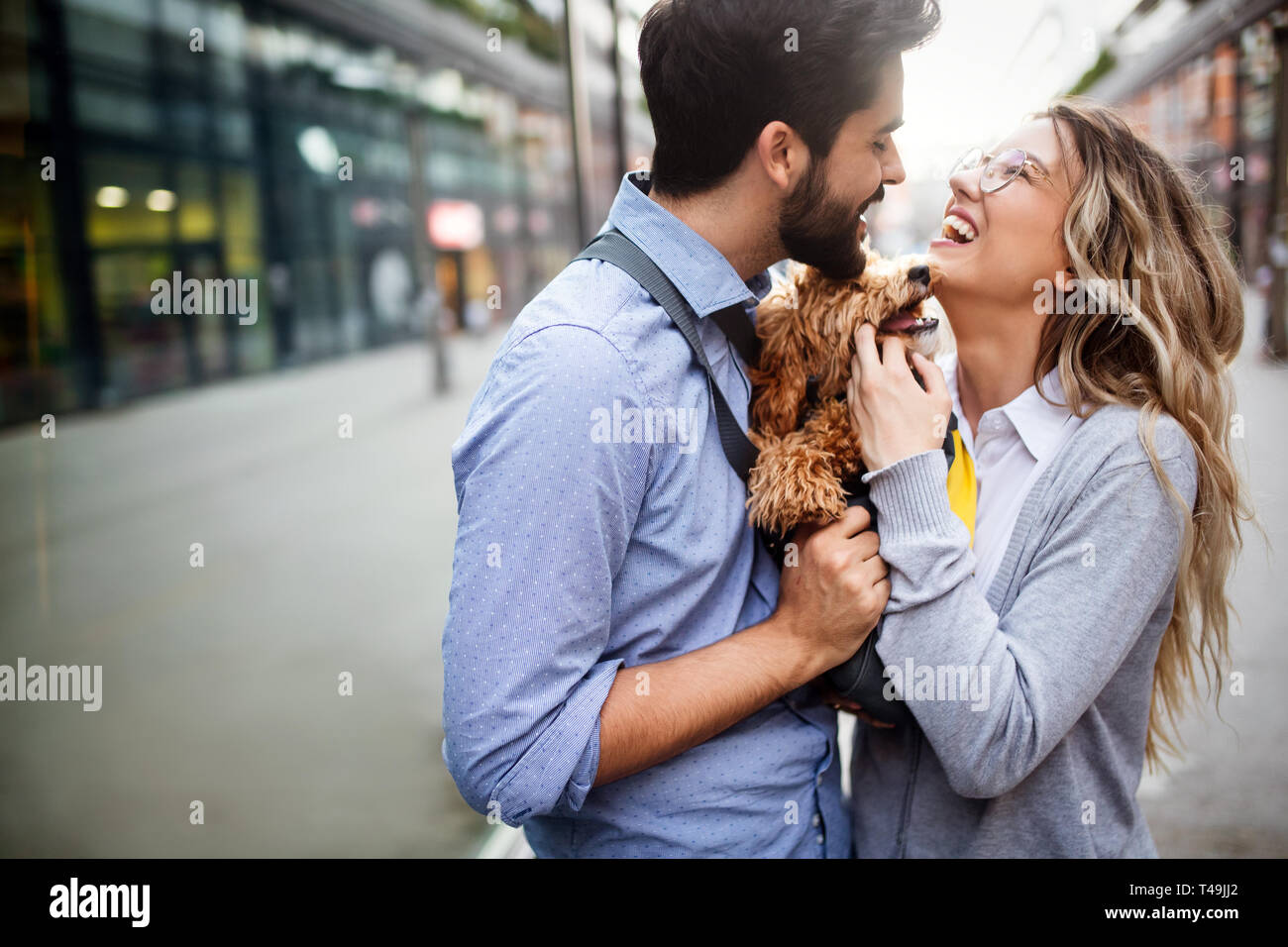 Couple in love with dog walking and smiling outdoor Stock Photo - Alamy