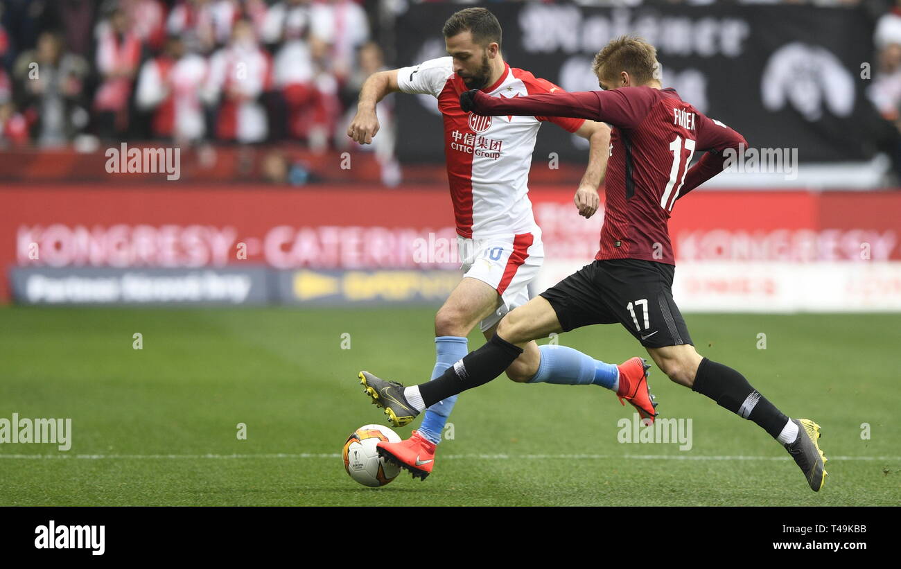 Prague, Czech Republic. 14th Apr, 2019. L-R Simon Deli (Slavia) and  Benjamin Tetteh (Sparta) are seen during the Czech first soccer league  (Fortuna Liga), 28th round, match SK Slavia Praha vs AC