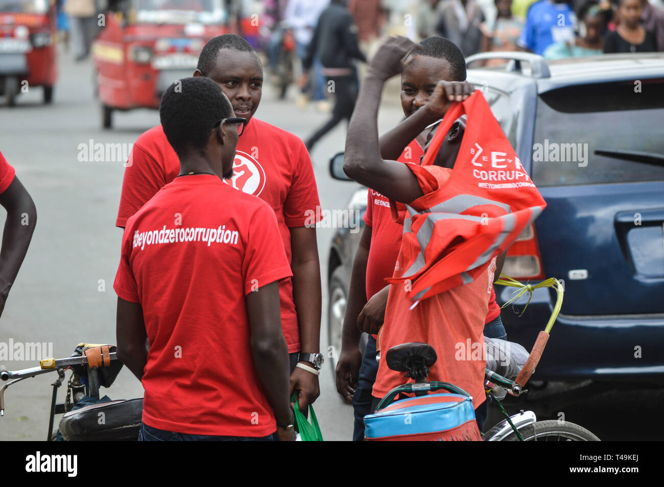 Nakuru, Rift Valley, Kenya. 14th Apr, 2019. A group of activists allied to Kenya's Red Vests Movement are seen engaging a member of the public in the streets of Nakuru during the anti-corruption protest.Activists allied to Kenya's Red Vests Movement were protesting silently about increased levels of corruption in the government, the activists are demanding action to be taken against all government officials involved in corruption. Credit: ZUMA Press, Inc./Alamy Live News Stock Photo
