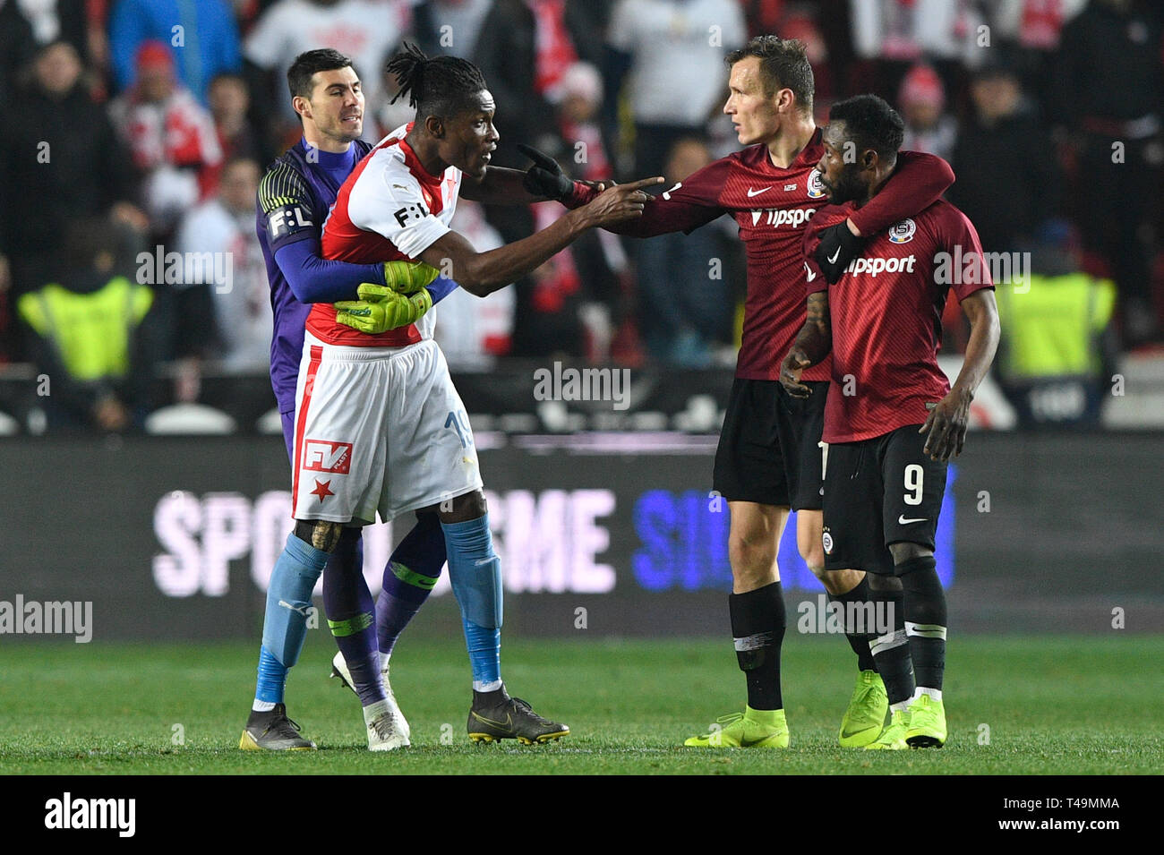 Prague, Czech Republic. 14th Apr, 2019. L-R Simon Deli (Slavia) and  Benjamin Tetteh (Sparta) are seen during the Czech first soccer league  (Fortuna Liga), 28th round, match SK Slavia Praha vs AC