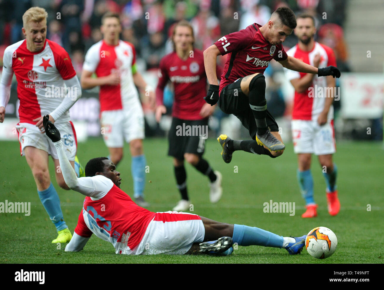 Prague, Czech Republic. 14th Apr, 2019. L-R Simon Deli (Slavia) and  Benjamin Tetteh (Sparta) are seen during the Czech first soccer league  (Fortuna Liga), 28th round, match SK Slavia Praha vs AC