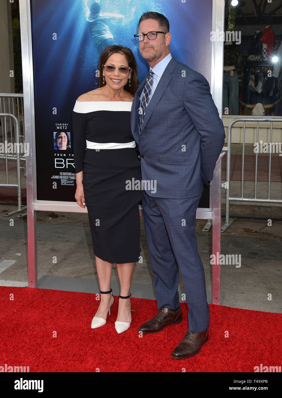 Roxann Dawson - director and husband attend the premiere of 20th Century Fox's 'Breakthrough' at Westwood Regency Theater on April 11, 2019 in Los Angeles, California. Stock Photo