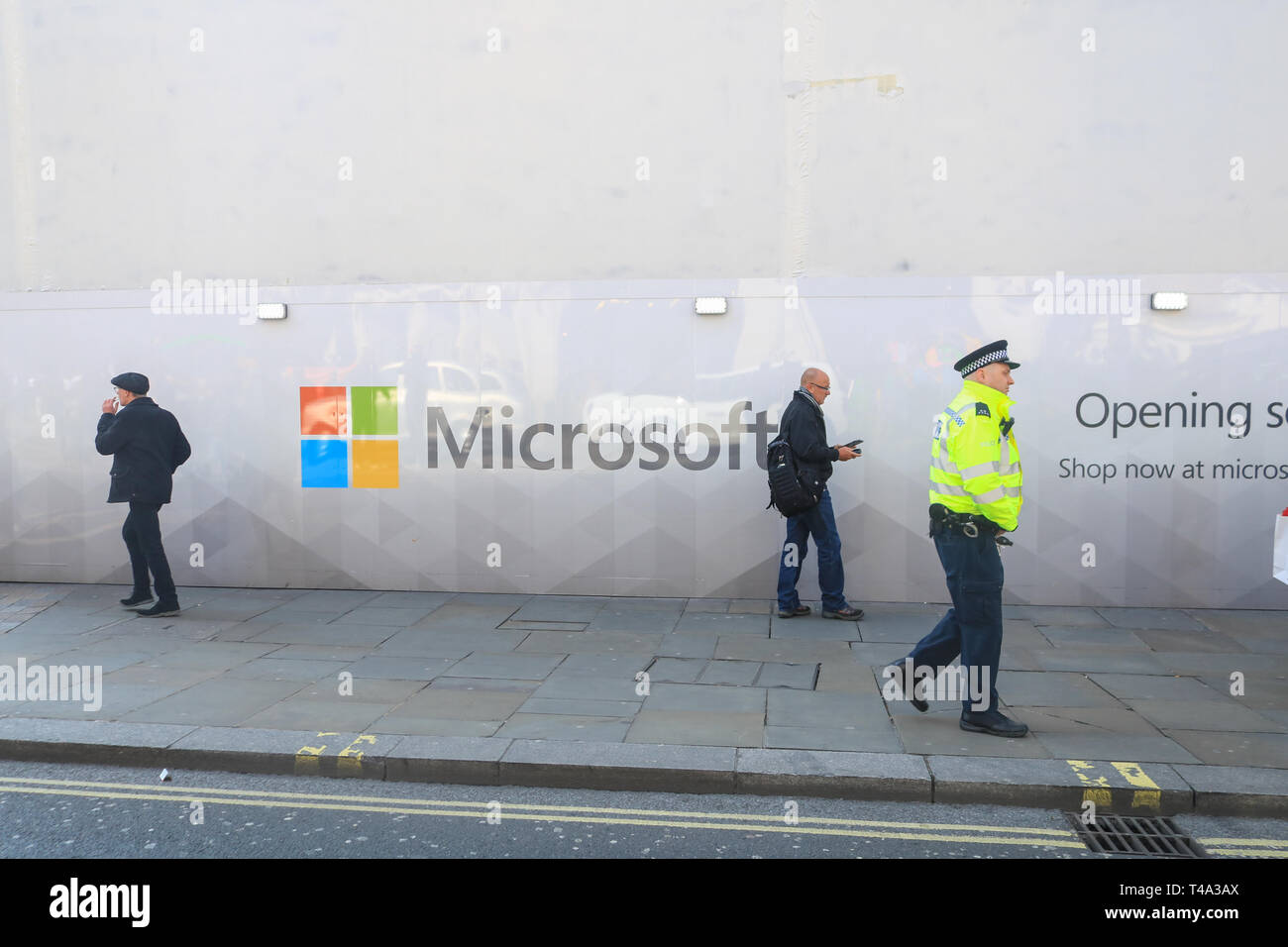 London, UK. 15th Apr, 2019. Pedestrians walk past a wall with the logo Microsoft Software giant as a new store prepares to open Oxford Street Credit: amer ghazzal/Alamy Live News Stock Photo