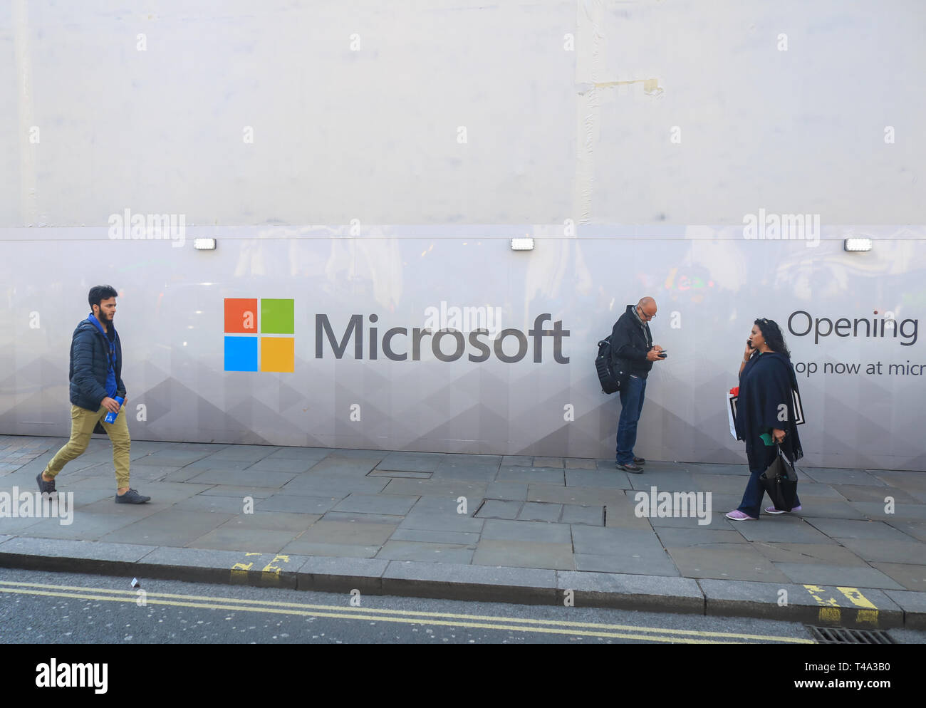 London, UK. 15th Apr, 2019. Pedestrians walk past a wall with the logo Microsoft Software giant as a new store prepares to open Oxford Street Credit: amer ghazzal/Alamy Live News Stock Photo
