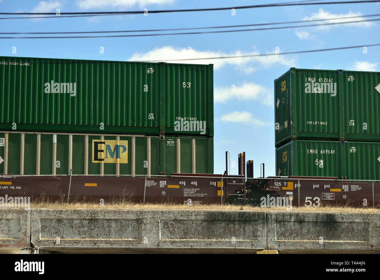 Chicago, Illinois, USA. A containerized stack train slowly crosses an overpass on the city's northwest side. Chicago is the rail capital of the US. Stock Photo