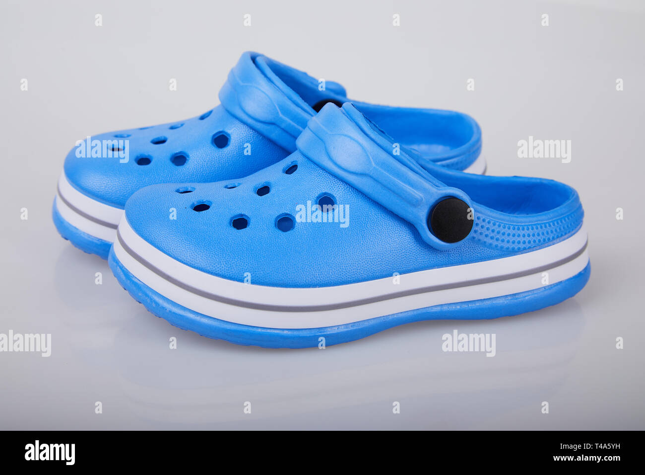 Blue rubber slippers, isolated on white background. Children's rubber  sandals isolated Stock Photo - Alamy