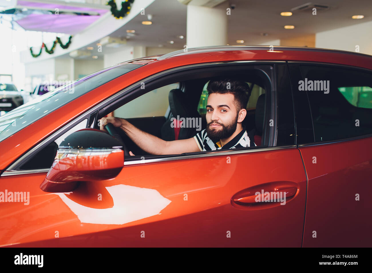 First test drive. Handsome young man ready to make first test drive ...