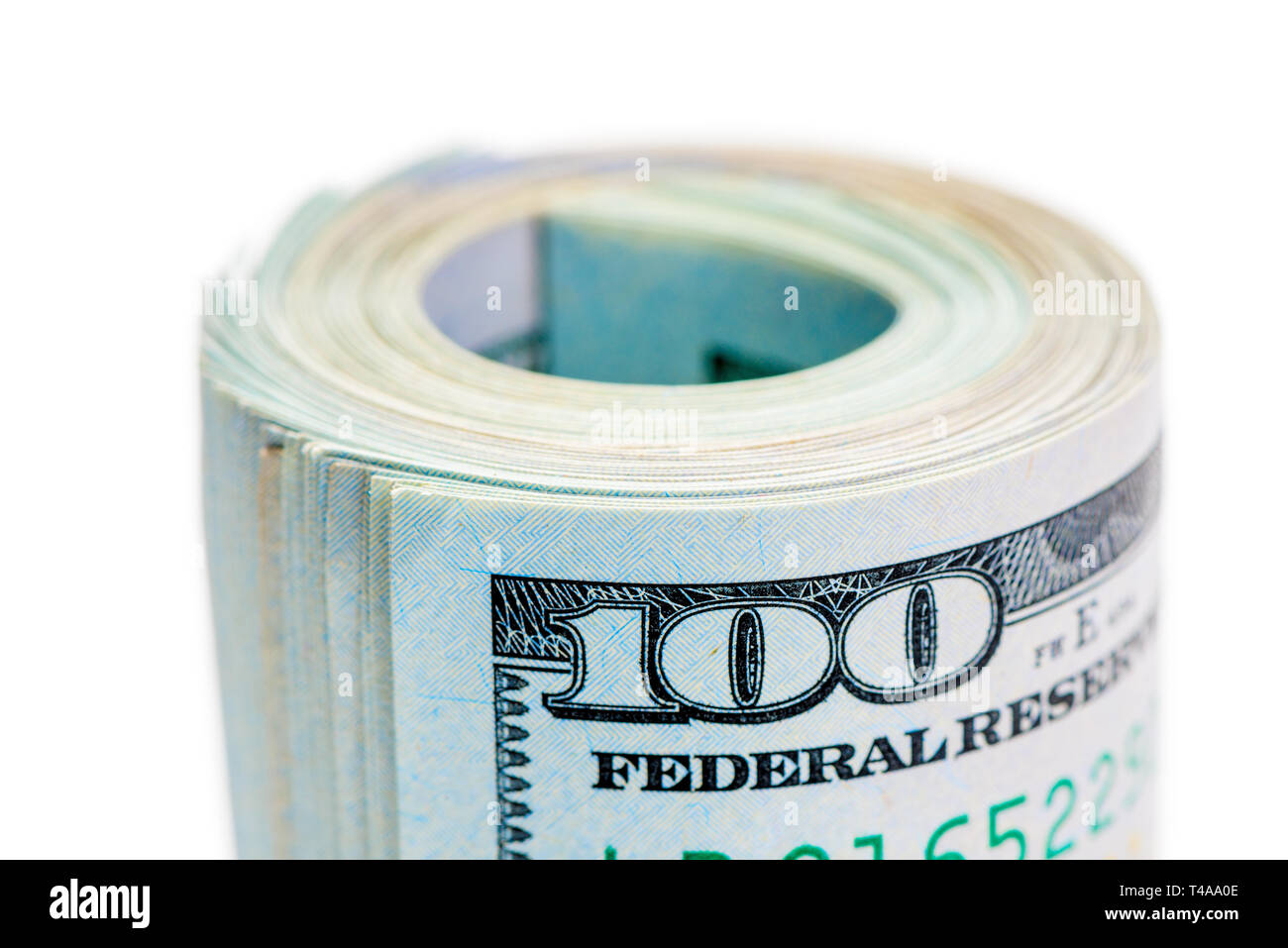 Macro roll of rolled up 100 dollar bills and tightened by rubber band ...