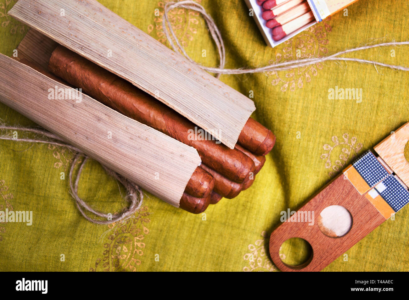 Bunch of Cuban cigars and accessories on a table Stock Photo