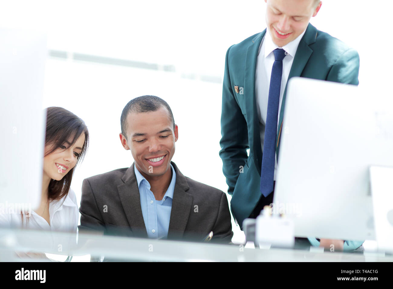 project Manager and business team discussing work documents Stock Photo