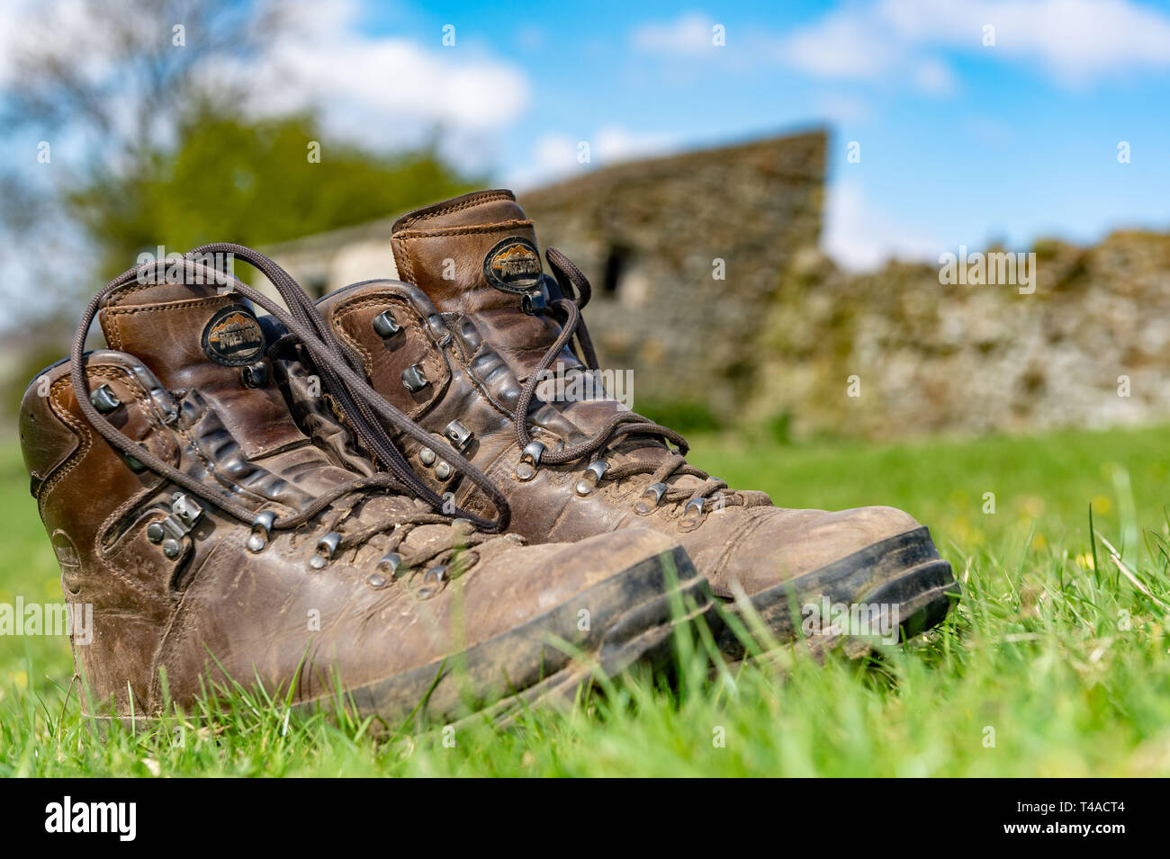 Muddy old walking boots hi-res stock photography and images - Alamy