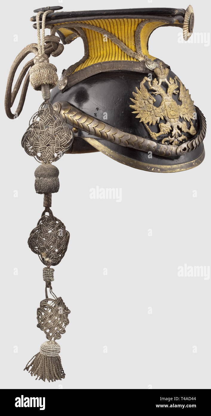 A czapka for officers of the Grand Duchess Maria Alexandrovna's 14th Yamburgsky Ulan Regiment, circa 1910. Leather body with silver-plated mountings, convex metal chinscales with the Russian stamp 'N 1, D. Sch', and velvet lining. Yellow ceremonial cover with the silver officer's cap-lines. Surrounding silver lace beneath the cover. Metal cockade. The interior bears an indistinct stamp and a damaged maker's label, 'Fokin', under the double-headed eagle. Leather sweatband. Fine, black silk lining (damaged). Signs of usage, historic, historical, 19, Additional-Rights-Clearance-Info-Not-Available Stock Photo