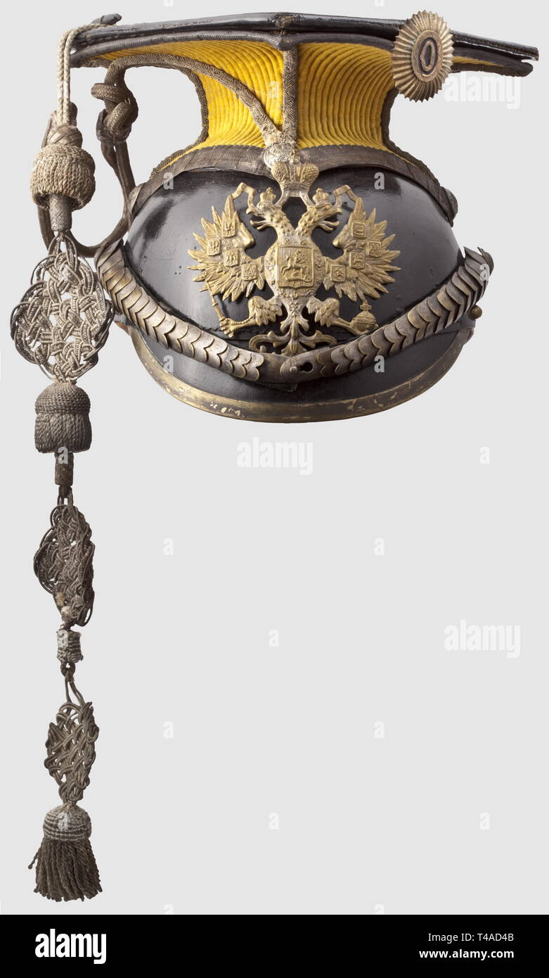 A czapka for officers of the Grand Duchess Maria Alexandrovna's 14th Yamburgsky Ulan Regiment, circa 1910. Leather body with silver-plated mountings, convex metal chinscales with the Russian stamp 'N 1, D. Sch', and velvet lining. Yellow ceremonial cover with the silver officer's cap-lines. Surrounding silver lace beneath the cover. Metal cockade. The interior bears an indistinct stamp and a damaged maker's label, 'Fokin', under the double-headed eagle. Leather sweatband. Fine, black silk lining (damaged). Signs of usage, historic, historical, 19, Additional-Rights-Clearance-Info-Not-Available Stock Photo