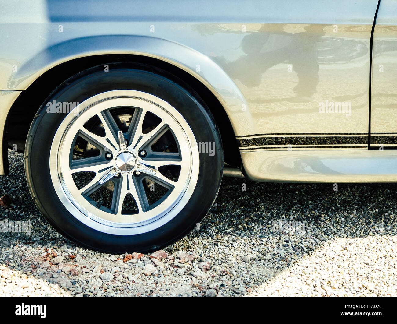 Detail of the wheel of a gray vintage car Stock Photo