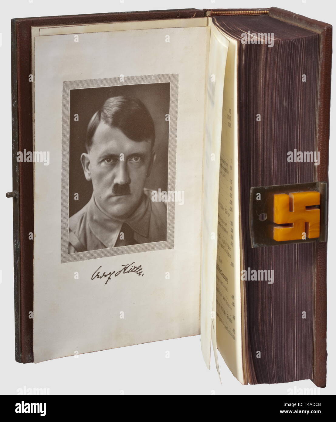 Adolf Hitler - a Königsberg amber edition of 'Mein Kampf', Two-volume edition in a single volume by the NSDAP Central Press, Franz Eher Nachf, Munich 1939, 781 pages, the anterior with slight signs of nibbling to the lower edges. Deluxe edition with applied, irregular amber plates and silver fittings: a party eagle in relief with straight wings (fineness mark '800' on the swastika) beneath 'Adolf Hitler' and above 'Mein Kampf' in Gothic script, at the corners decorative pyramidal studs. The cover interior with metal manufacturer's plate 'Hergestellt von: Norddeutsche Bernst, Editorial-Use-Only Stock Photo