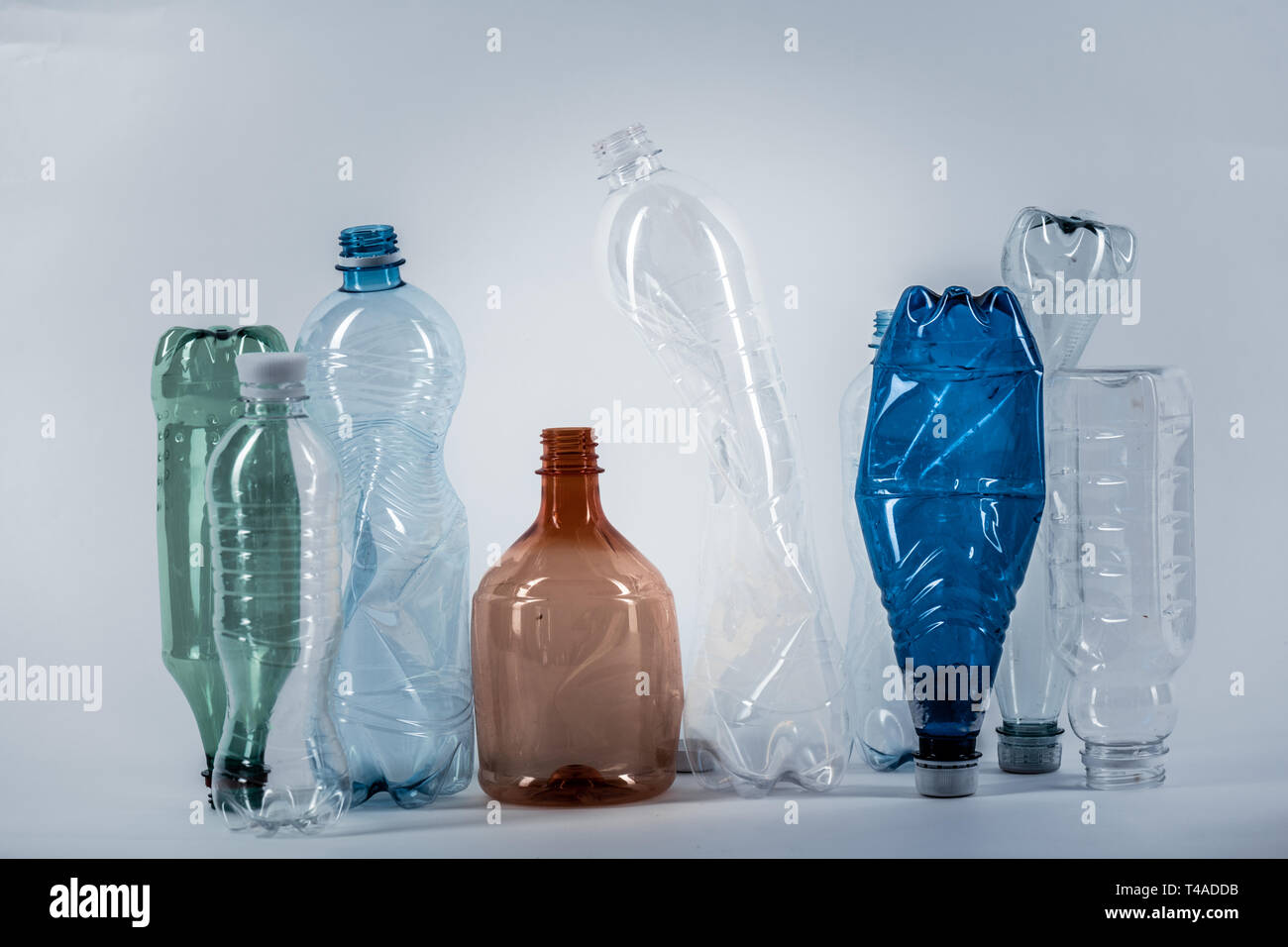 Crumples various water bottles standing in a row Stock Photo